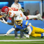 
              Kansas City Chiefs tight end Jody Fortson, top, makes a catch as Los Angeles Chargers cornerback Bryce Callahan defends during the first half of an NFL football game Sunday, Nov. 20, 2022, in Inglewood, Calif. (AP Photo/Jae C. Hong)
            