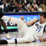 
              Dallas Mavericks guard Luka Doncic (77) has a laugh after he fell to the floor during the first half of an NBA basketball game against the Los Angeles Clippers in Dallas, Tuesday, Nov. 15, 2022. (AP Photo/LM Otero)
            