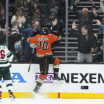 
              Anaheim Ducks' Pavol Regenda with fans after his goal against the Minnesota Wild during the second period of an NHL hockey game Wednesday, Nov. 9, 2022, in Anaheim, Calif. (AP Photo/Jae C. Hong)
            