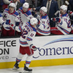 
              New York Rangers right wing Julien Gauthier (12) is congratulated after scoring against the San Jose Sharks during the third period of an NHL hockey game in San Jose, Calif., Saturday, Nov. 19, 2022. (AP Photo/Jeff Chiu)
            