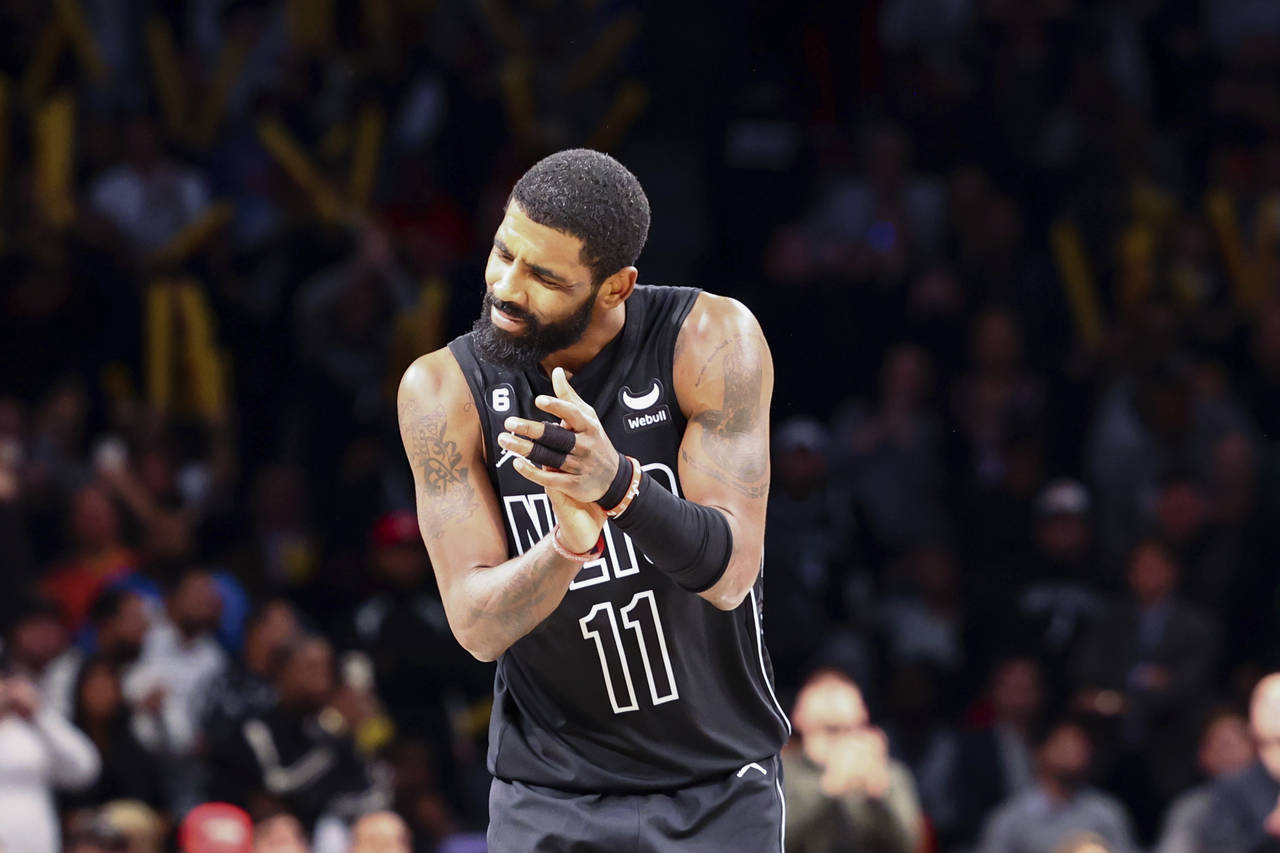 Brooklyn Nets guard Kyrie Irving (11) reacts after the team defeated the Indiana Pacers in an NBA b...