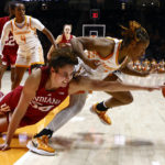 
              CORRECTS ID TO TENNESSEE GUARD JASMINE POWELL INSTEAD OF FORWARD JILLIAN HOLLINGSHEAD - Indiana forward Mackenzie Holmes (54) dives for the ball as she battles for a rebound with Tennessee guard Jasmine Powell, right, during the second half of an NCAA college basketball game, Monday, Nov. 14, 2022, in Knoxville, Tenn. (AP Photo/Wade Payne)
            