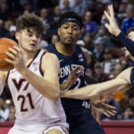 
              Virginia Tech's Grant Basile (21) goes up for a shot as Penn State's Andrew Funk (10) defends in the second half of an NCAA college basketball game at the Charleston Classic in Charleston, S.C., Friday, Nov. 18, 2022. (AP Photo/Mic Smith)
            