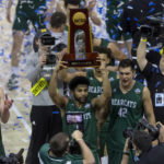 
              FILE - Northwest Missouri's Trevor Hudgins holds up the trophy after the Bearcats defeated Augusta in the championship game of the NCAA Division II men's basketball tournament at Ford Center in Evansville, Ind., Saturday, March 26, 2022. Hudgins became the first Northwest Missouri State player in the NBA when he signed with the Houston Rockets over the summer. (Macabe Brown/Evansville Courier & Press via AP, File)
            