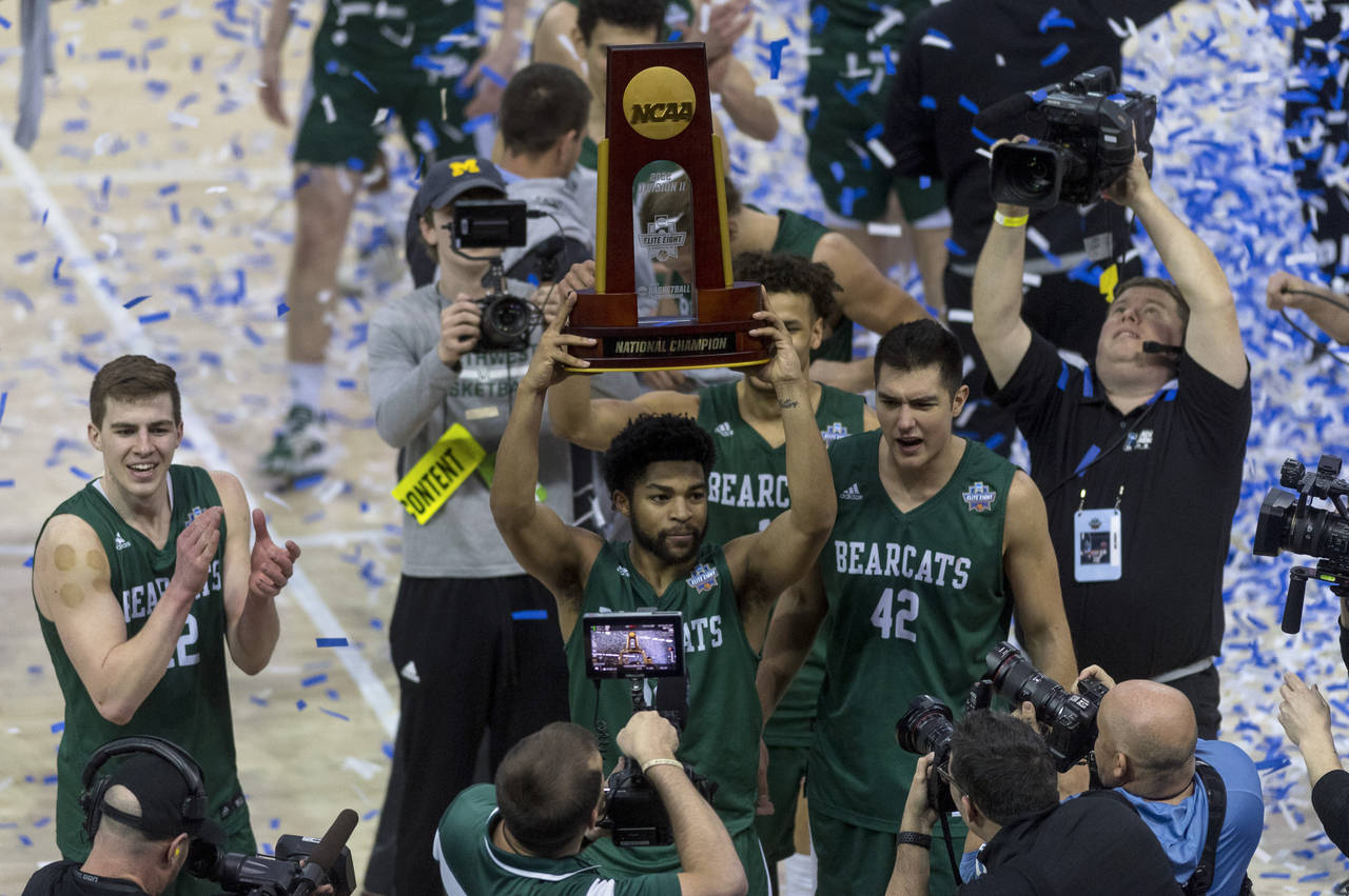 FILE - Northwest Missouri's Trevor Hudgins holds up the trophy after the Bearcats defeated Augusta ...