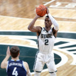 
              Michigan State's Tyson Walker shoots against Villanova's Chris Arcidiacono during the first half of an NCAA college basketball game Friday, Nov. 18, 2022, in East Lansing, Mich. (AP Photo/Al Goldis)
            