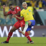 
              Switzerland's Ricardo Rodriguez, left, and Brazil's Richarlison challenge for the ball during the World Cup group G soccer match between Brazil and Switzerland, at the Stadium 974 in Doha, Qatar, Monday, Nov. 28, 2022. (AP Photo/Natacha Pisarenko)
            