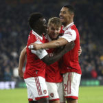 
              Arsenal's Martin Odegaard, center, celebrates scoring against Arsenal with teammates during the English Premier League soccer match at Molineux, Wolverhampton, England, Saturday Nov. 12, 2022. (Nigel French/PA via AP)
            
