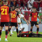 
              Belgium's Amadou Onana falls during the World Cup group F soccer match between Belgium and Morocco, at the Al Thumama Stadium in Doha, Qatar, Sunday, Nov. 27, 2022. (AP Photo/Alessandra Tarantino)
            