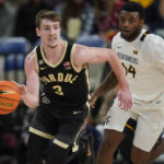 
              Purdue guard Braden Smith (3) brings the ball upcourt as West Virginia guard Seth Wilson (14) defends during the first half of an NCAA college basketball game in the Phil Knight Legacy tournament Thursday, Nov. 24, 2022, in Portland, Ore. (AP Photo/Rick Bowmer)
            