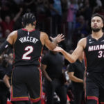 
              Miami Heat guard Max Strus (31) is congratulated by guard Gabe Vincent (2) after Strus scored during the first half of an NBA basketball game against the Golden State Warriors, Tuesday, Nov. 1, 2022, in Miami. (AP Photo/Wilfredo Lee)
            