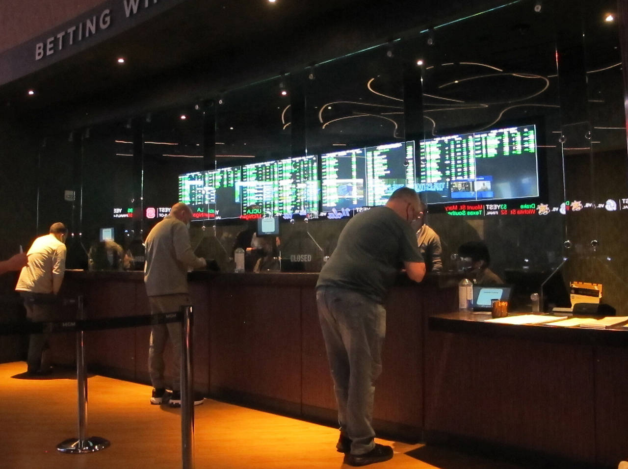 FILE - People line up to make sports bets at the Borgata casino in Atlantic City, N.J., March 19, 2...