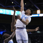 
              UCLA guard Jaylen Clark (0) grabs a rebound during the first half of the team's NCAA college basketball game against Long Beach State on Friday, Nov. 11, 2022, in Los Angeles. (AP Photo/Marcio Jose Sanchez)
            