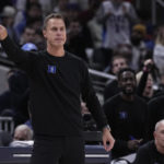 
              Duke head coach Jon Scheyer signals to his players during the second half of an NCAA college basketball game against Kansas, Tuesday, Nov. 15, 2022, in Indianapolis. (AP Photo/Darron Cummings)
            
