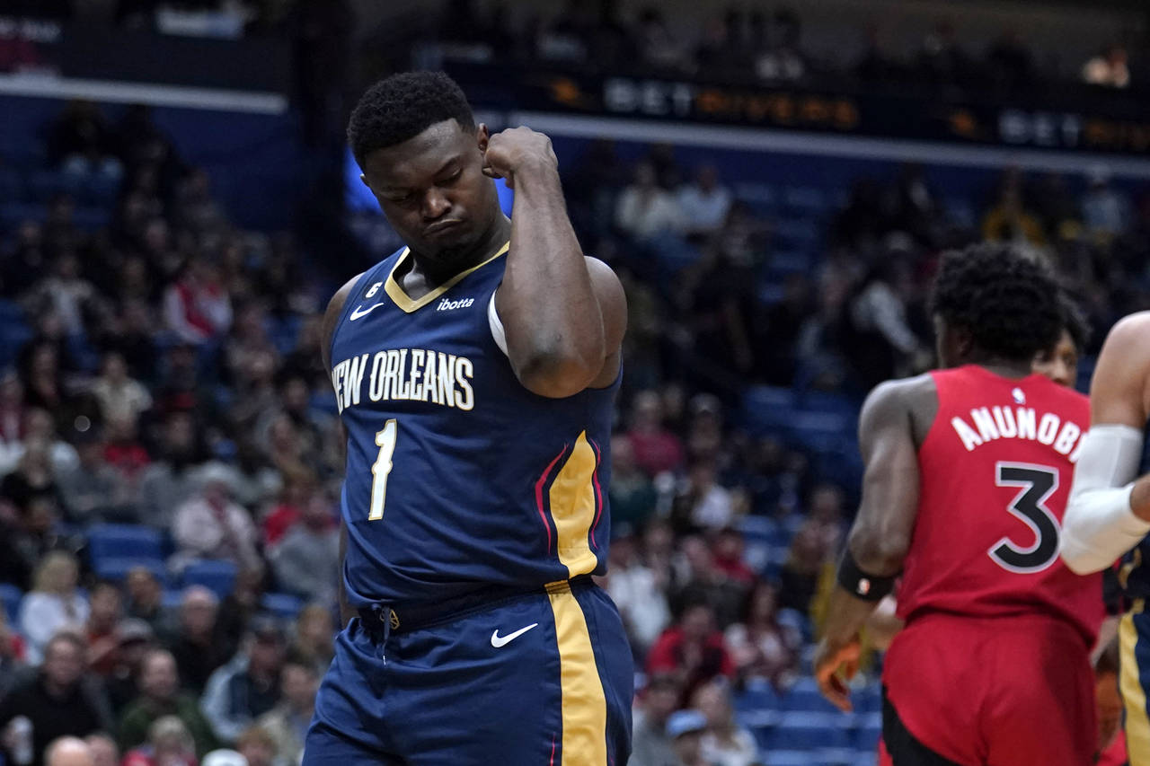 New Orleans Pelicans forward Zion Williamson (1) flexes his bicep after scoring a basket in the fir...