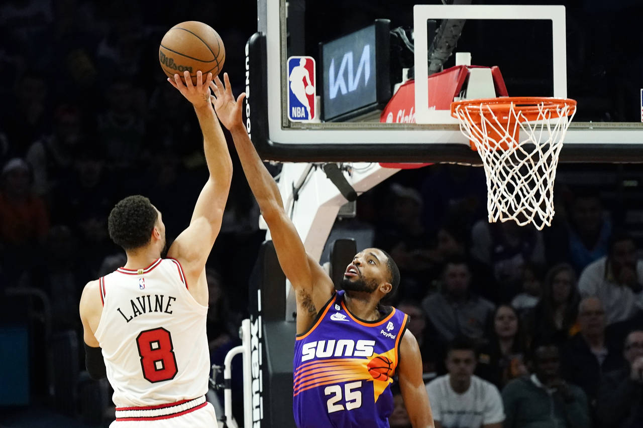 Chicago Bulls guard Zach LaVine (8) shoots over Phoenix Suns forward Mikal Bridges (25) during the ...