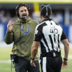 
              Indianapolis Colts head coach Jeff Saturday talks with line judge Brian Bolinger in the first half of an NFL football game against the Philadelphia Eagles in Indianapolis, Sunday, Nov. 20, 2022. (AP Photo/Darron Cummings)
            