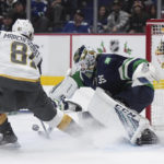 
              Vancouver Canucks goalie Thatcher Demko, right, stops Vegas Golden Knights' Jonathan Marchessault during first-period NHL hockey game action in Vancouver, British Columbia, Monday, Nov. 21, 2022. (Darryl Dyck/The Canadian Press via AP)
            