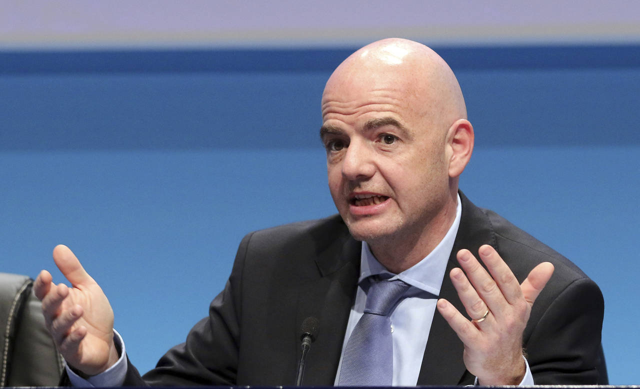 FILE - UEFA Secretary General Gianni Infantino speaks during a news conference at the end of the 39...