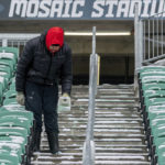 
              A person sprinkles salt on the staircase as the Toronto Argonauts workout at Mosaic Stadium during CFL football practice in Regina, Saskatchewan Friday, Nov. 18, 2022. The Argonauts play the Winnipeg Blue Bombers in the 109th Grey Cup game on Sunday. (Heywood Yu/The Canadian Press via AP)
            