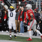 
              Michigan defensive back Mike Sainristil celebrates breaking up a pass against Ohio State tight end Cade Stover during the second half of an NCAA college football game on Saturday, Nov. 26, 2022, in Columbus, Ohio. (AP Photo/Jay LaPrete)
            