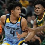 
              Marquette's Stevie Mitchell tries to get past Baylor's Langston Love during the first half of an NCAA basketball game Tuesday, Nov. 29, 2022, in Milwaukee. (AP Photo/Morry Gash)
            