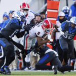 
              Georgia running back Kenny McIntosh (6) is brought down during the first half of an NCAA college football game against Kentucky in Lexington, Ky., Saturday, Nov. 19, 2022. (AP Photo/Michael Clubb)
            