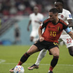 
              Belgium's Eden Hazard, left, challenges for the ball with Canada's Richie Laryea during the World Cup group F soccer match between Belgium and Canada, at the Ahmad Bin Ali Stadium in Doha, Qatar, Wednesday, Nov. 23, 2022. (AP Photo/Hassan Ammar)
            
