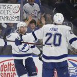 
              Tampa Bay Lightning center Steven Stamkos and left wing Nicholas Paul (20) celebrate after Stamkos scored a game-winning overtime goal against the Buffalo Sabres on Monday, Nov. 28, 2022, in Buffalo, N.Y. (AP Photo/Joshua Bessex)
            