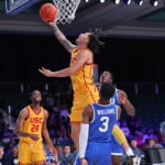 
              In a photo provided by Bahamas Visual Services, Southern California's Tre White shoots in front of BYU's Rudi Williams (3) during an NCAA college basketball game in the Battle 4 Atlantis at Paradise Island, Bahamas, Wednesday, Nov. 23, 2022. (Tim Aylen/Bahamas Visual Services via AP)
            