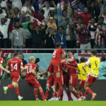 
              Wales players celebrate after Gareth Bale scored their side's first goal from the penalty spot during the World Cup, group B soccer match between the United States and Wales, at the Ahmad Bin Ali Stadium in Doha, Qatar, Monday, Nov. 21, 2022. (AP Photo/Francisco Seco)
            