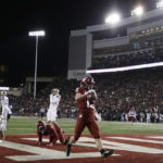 
              Washington State wide receiver Robert Ferrel (12) runs for a touchdown during the first half of an NCAA college football game against Washington, Saturday, Nov. 26, 2022, in Pullman, Wash. (AP Photo/Young Kwak)
            