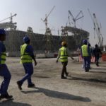 
              FILE - Laborers walk to the Lusail Stadium, one of the 2022 World Cup stadiums, in Lusail, Qatar, Friday, Dec. 20, 2019. With just days to go before Qatar hosts the World Cup, rights groups fear that a window for addressing the widespread exploitation of foreign workers could soon close. (AP Photo/Hassan Ammar, File)
            