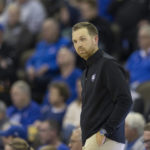 
              Holy Cross head coach Brett Nelson reacts after a play against Creighton during the first half of an NCAA college basketball game on Monday, Nov. 14, 2022, in Omaha, Neb. (AP Photo/Rebecca S. Gratz)
            