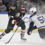 
              Buffalo Sabres right wing Alex Tuch (89) shoots while defended by St. Louis Blues defenseman Colton Parayko (55) during the first period of an NHL hockey game Wednesday, Nov. 23, 2022, in Buffalo, N.Y. (AP Photo/Joshua Bessex)
            