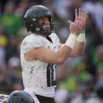 
              Oregon quarterback Bo Nix calls for a timeout in the second half of an NCAA college football game against Colorado, Saturday, Nov. 5, 2022, in Boulder, Colo. (AP Photo/David Zalubowski)
            