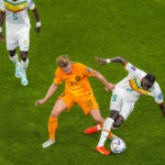 
              Frankie de Jong of the Netherlands , vies for the ball with Senegal's Cheikhou Kouyate during the World Cup, group A soccer match between Senegal and Netherlands at the Al Thumama Stadium in Doha, Qatar, Monday, Nov. 21, 2022. (AP Photo/Thanassis Stavrakis)
            