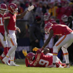 
              Kansas City Chiefs wide receiver JuJu Smith-Schuster (9) is checked on by teammates after being hit hard by Jacksonville Jaguars safety Andre Cisco during the first half of an NFL football game Sunday, Nov. 13, 2022, in Kansas City, Mo. (AP Photo/Charlie Riedel)
            