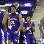 
              Northwestern State center Jordan Wilmore (32) reacts to scoring with Greedy Williams (10) and other teammates as TCU forward Emanuel Miller (2) looks away during the second half of an NCAA college basketball game in Fort Worth, Texas, Monday, Nov. 14, 2022. Northwestern State won 64-63. (AP Photo/LM Otero)
            