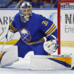 
              Buffalo Sabres goaltender Eric Comrie (31) slides across the crease during the second period of an NHL hockey game against the Arizona Coyotes, Tuesday, Nov. 8, 2022, in Buffalo, N.Y. (AP Photo/Jeffrey T. Barnes)
            