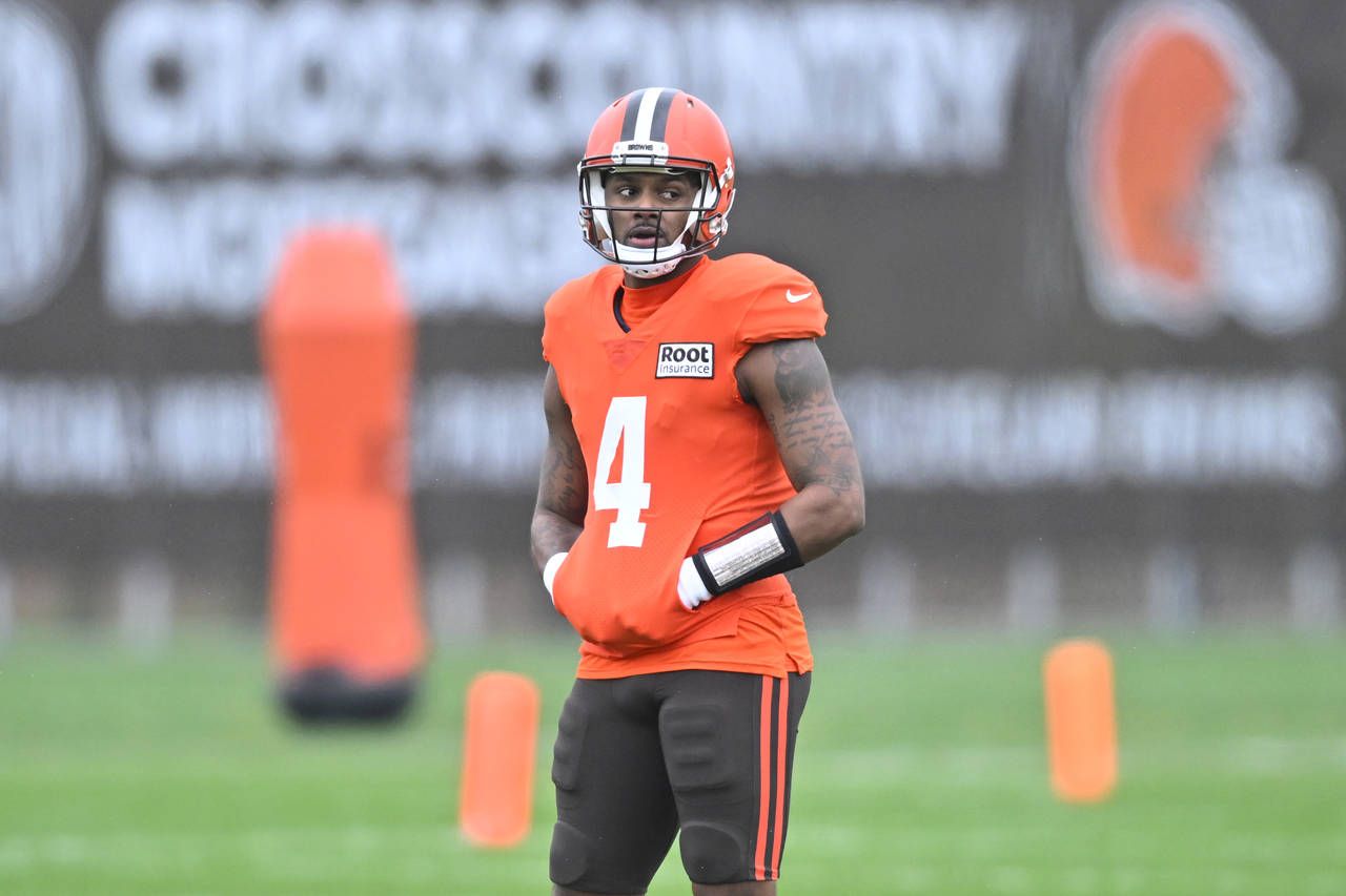 Cleveland Browns quarterback Deshaun Watson stands on the field during an NFL football practice at ...