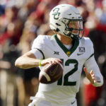 
              Baylor quarterback Blake Shapen looks for a receiver against Oklahoma in the first half of an NCAA college football game, Saturday, Nov. 5, 2022, in Norman, Okla. (AP Photo/Nate Billings)
            