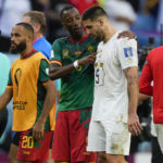 
              Cameroon's Gael Ondoua, left, talks to Serbia's Aleksandar Mitrovic after the World Cup group G soccer match between Cameroon and Serbia, at the Al Janoub Stadium in Al Wakrah, Qatar, Monday, Nov. 28, 2022. (AP Photo/Frank Augstein)
            