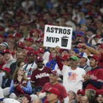 
              A fans hold a sign during the fourth inning in Game 3 of baseball's World Series between the Houston Astros and the Philadelphia Phillies on Tuesday, Nov. 1, 2022, in Philadelphia. (AP Photo/Matt Slocum)
            