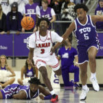 
              Lamar guard Jakevion Buckley (3) and TCU forward Chuck O'Bannon Jr. (5) chase a loose ball during the first half of an NCAA college basketball game Friday, Nov. 11, 2022, in Fort Worth, Texas. (AP Photo/Richard W. Rodriguez)
            