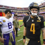 
              Washington Commanders quarterback Taylor Heinicke (4) walks away after speaking with Minnesota Vikings quarterback Kirk Cousins (8) on the field at the end of their NFL football game, Sunday, Nov. 6, 2022, in Landover, Md. Vikings won 20-17. (AP Photo/Nick Wass)
            