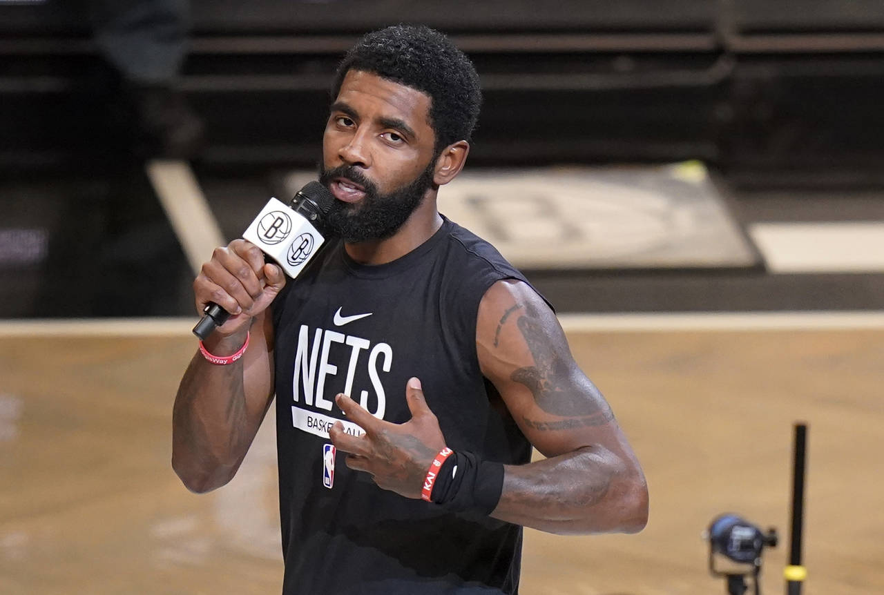 FILE - Brooklyn Nets' Kyrie Irving speaks before the team's NBA basketball game against the New Orl...