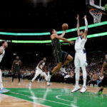 
              Boston Celtics guard Malcolm Brogdon drives to the basket against Dallas Mavericks center Christian Wood (35) during the first half of an NBA basketball game, Wednesday, Nov. 23, 2022, in Boston. (AP Photo/Mary Schwalm)
            