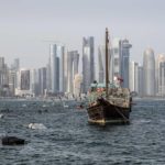 
              Old wooden boats anchor at the Doha Corniche in front of the modern skyline on the day before the start of the Soccer World Cup in Doha, Qatar, Saturday, Nov. 19, 2022. (AP Photo/Martin Meissner)
            