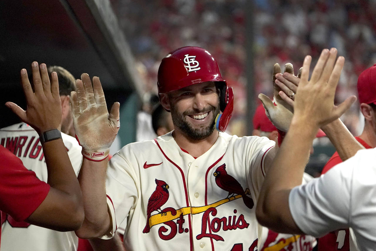 FILE - St. Louis Cardinals' Paul Goldschmidt is congratulated by teammates after scoring during the...